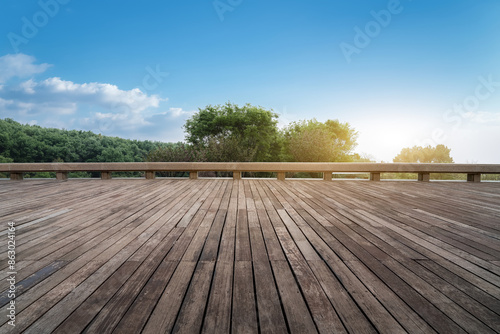 Serene Wooden Deck Overlooking Forest at Sunrise