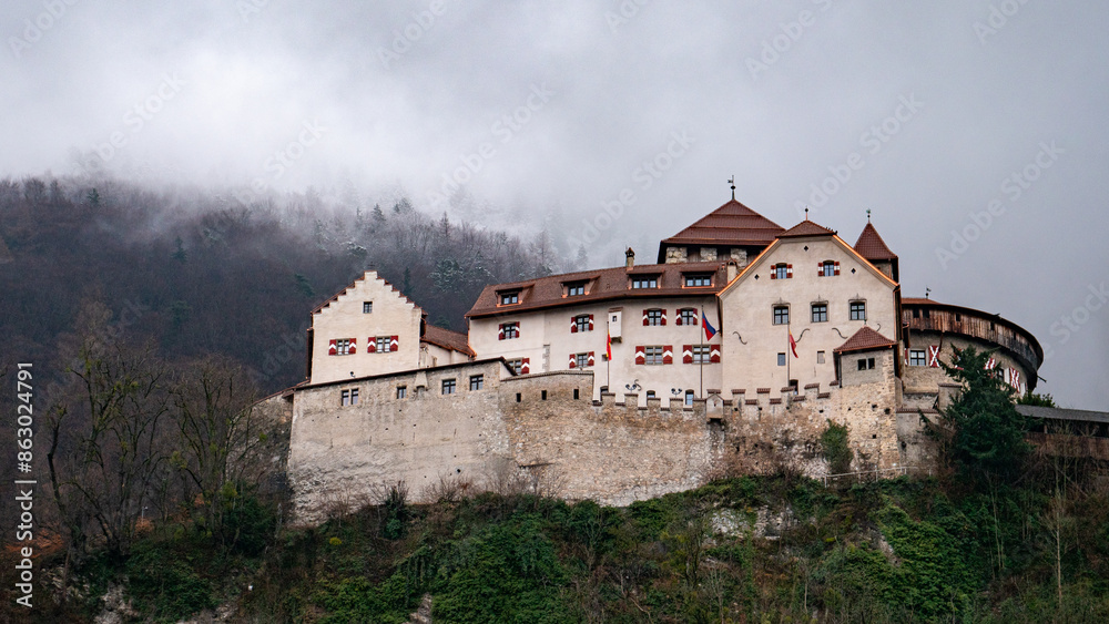 Vaduz castle under a cloudy sky in winter Vaduz castle under a cloudy sky in winter