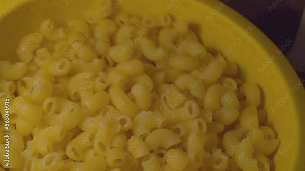 Mix pasta in a plastic colander. Slow motion and close up video. Mix pasta in a plastic colander. Slow motion and close up video.