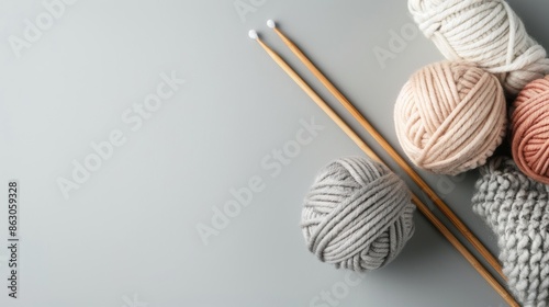 Yarn Balls, Knitting Needles, and a Knitted Fabric