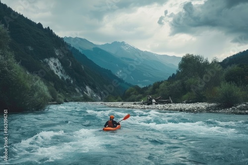 Whitewater kayaking extreme kayaking. A guy in a kayak sails on a mountain river