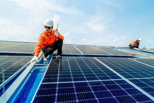 Wallpaper Mural engineer man inspects construction of solar cell panel or photovoltaic cell by electronic device. Industrial Renewable energy of green power. factory worker working on tower roof. Torontodigital.ca