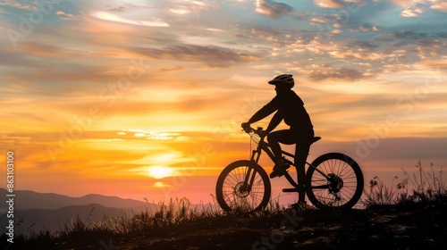 Wallpaper Mural Cyclist silhouetted against a vibrant sunset Torontodigital.ca