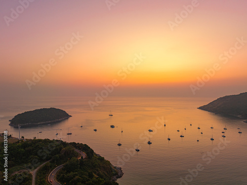 Aerial view Beautiful colorful sunset at the sea with dramatic sky over Naiharn beach Phuket.. Nai Harn beach is a famous landmark and popular sunset viewpoint of Phuket Thailand. photo