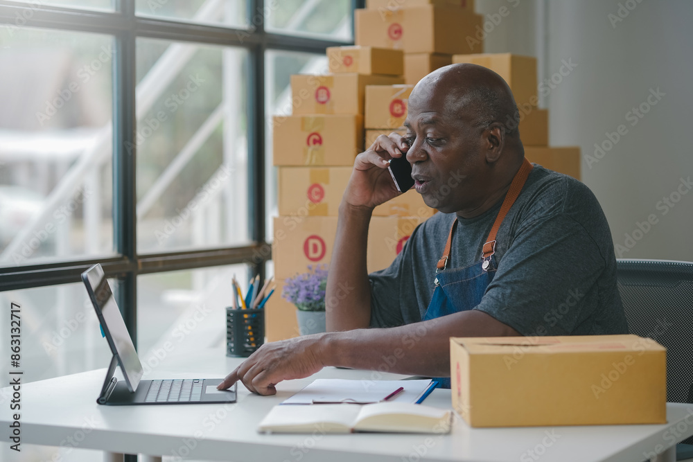 Dedicated worker talks on phone while managing orders in a busy warehouse, ensuring efficient logistics and customer satisfaction. Dedicated worker talks on phone while managing orders in a busy warehouse, ensuring efficient logistics and customer satisfaction.