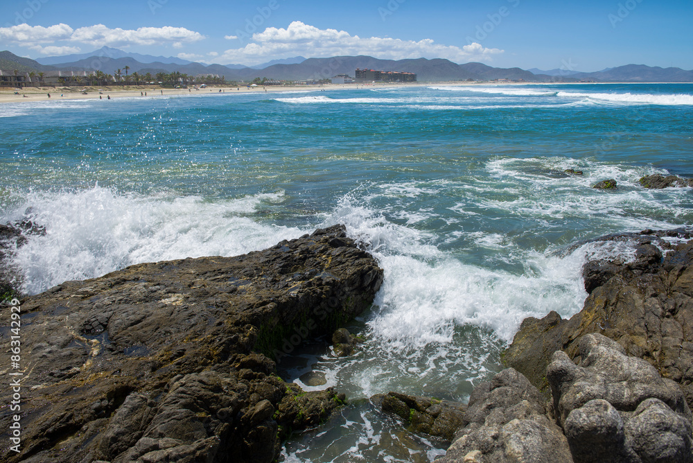Mountains and sea of the Pacific Ocean on LOS CERRITOS beach, sunny summer vacation day, nature of Todos Santos Baja California Sur. MEXICO Horizontal seascape of The Baja. Mountains and sea of the Pacific Ocean on LOS CERRITOS beach, sunny summer vacation day, nature of Todos Santos Baja California Sur. MEXICO Horizontal seascape of The Baja.