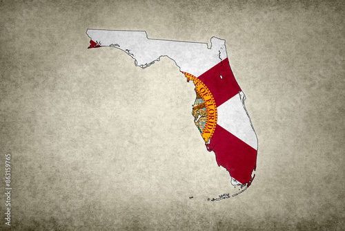 Map of Florida with its flag on a paper