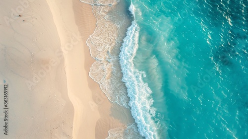 Aerial view of tide blue sea water and sandy beach