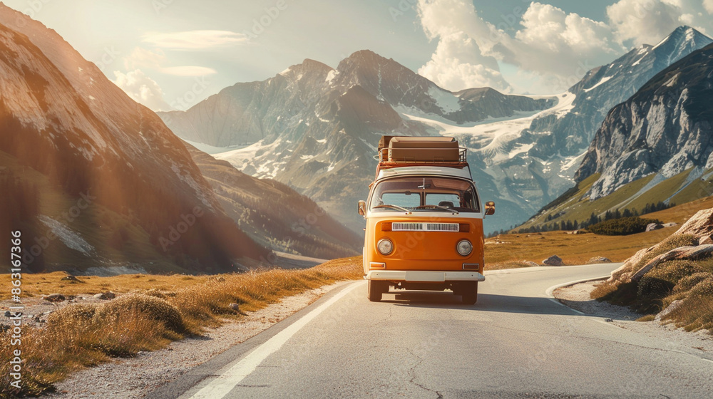 Vintage camper van with luggage box on top driving on road in ...