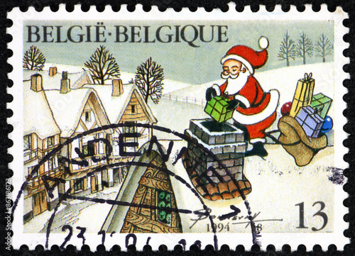 Obraz na płótnie Postage stamp Belgium 1994 Santa Claus on rooftop, Christmas w salonie