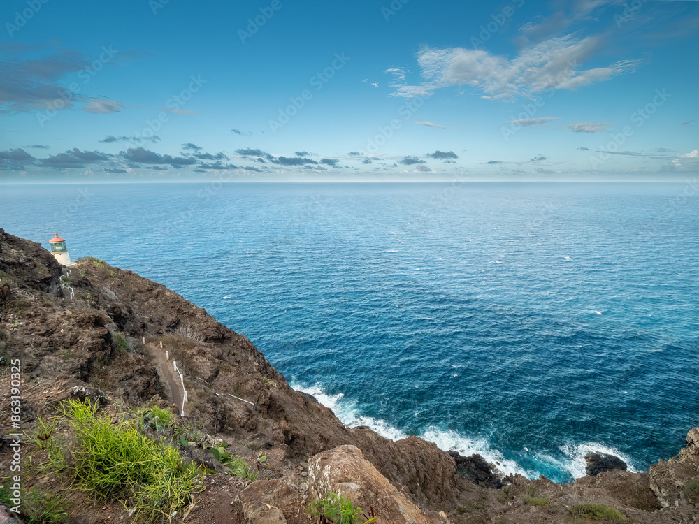 Makapuu Light House on a rock and the pacific ocean at the background Makapuu Light House on a rock and the pacific ocean at the background