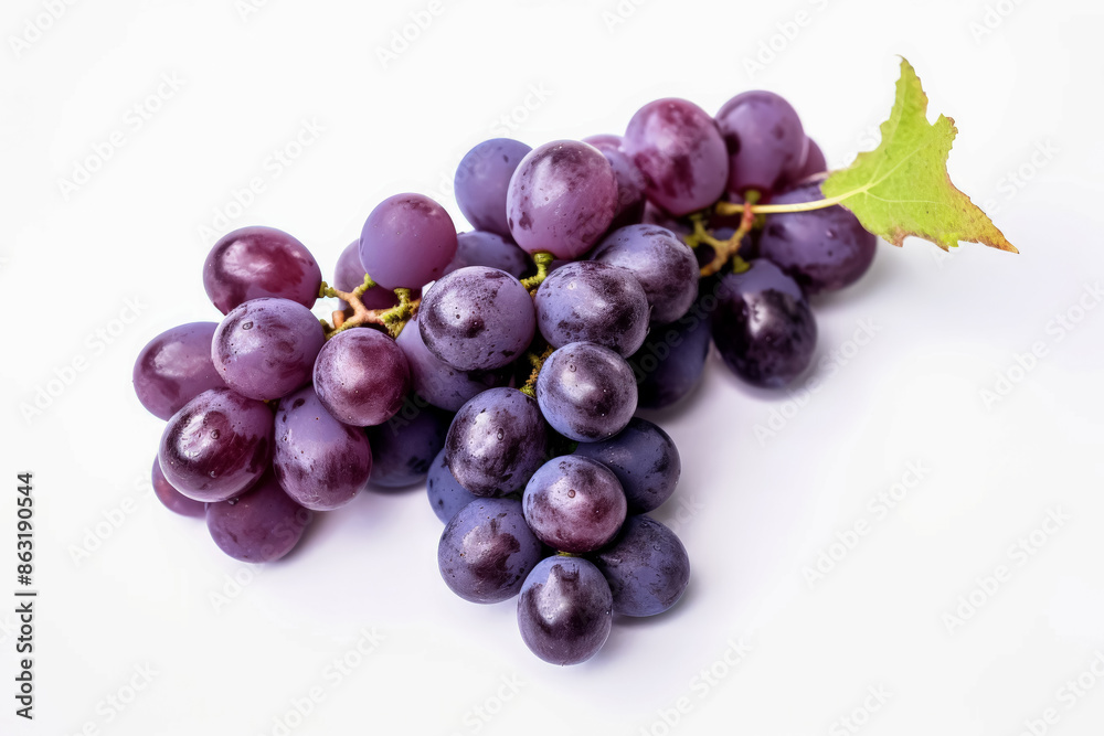 Fototapeta premium A bunch of purple grapes with a leaf on top. The grapes are wet and shiny. Concept of freshness and abundance