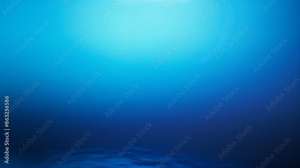 A deep blue underwater scene with a bright light shining from above.  The water is clear and inviting, with a slight ripple effect.