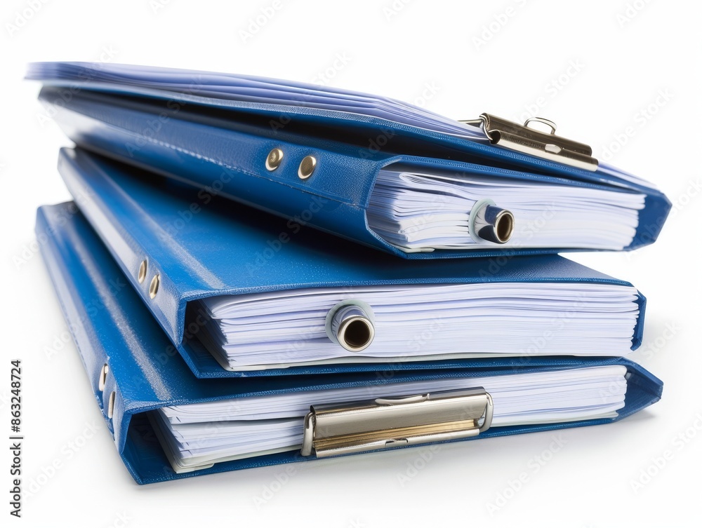 A stack of three blue binders with white papers inside, isolated on white background. A stack of three blue binders with white papers inside, isolated on white background.