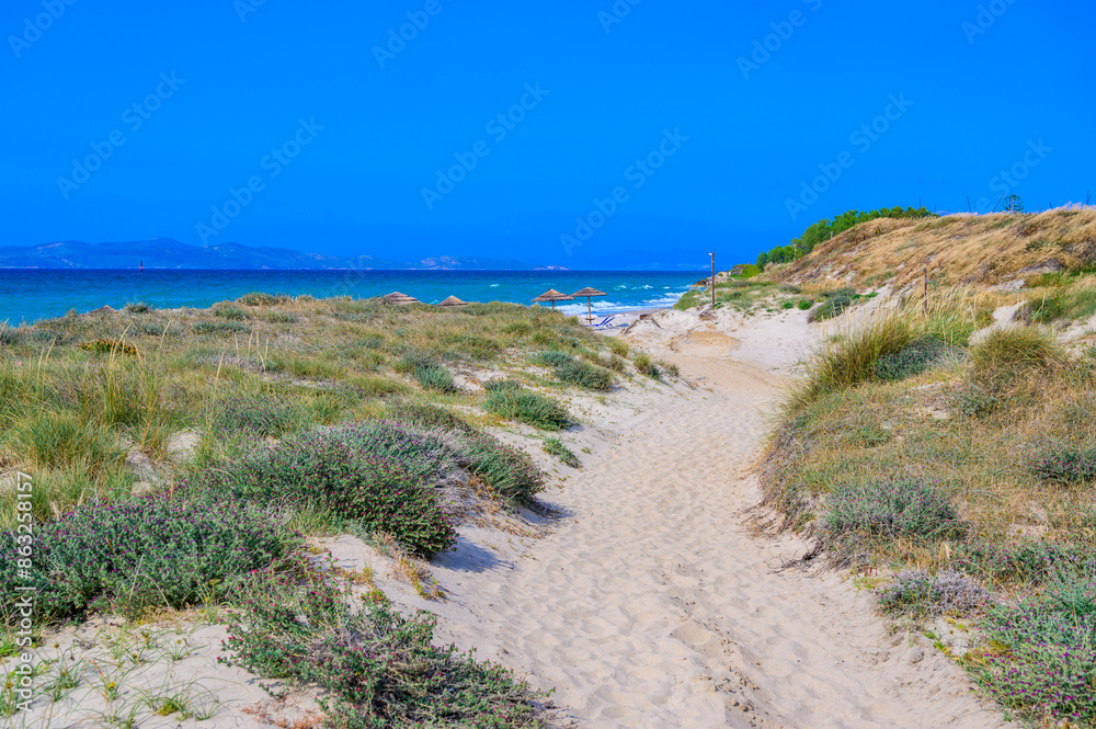 Tam Tam Beach - beautiful coast scenery with paradise beach on island Kos - travel destination in Greece, Europe Tam Tam Beach - beautiful coast scenery with paradise beach on island Kos - travel destination in Greece, Europe