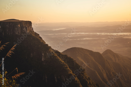 an orange and stunning sunrise in Serra do Rio do Rastro, a big range of mountains in Santa Catarina, South of Brazil photo