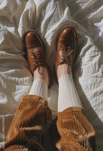 Woman Laying on Bed With Crossed Legs