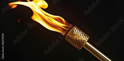 Black background with a bright Olympic torch