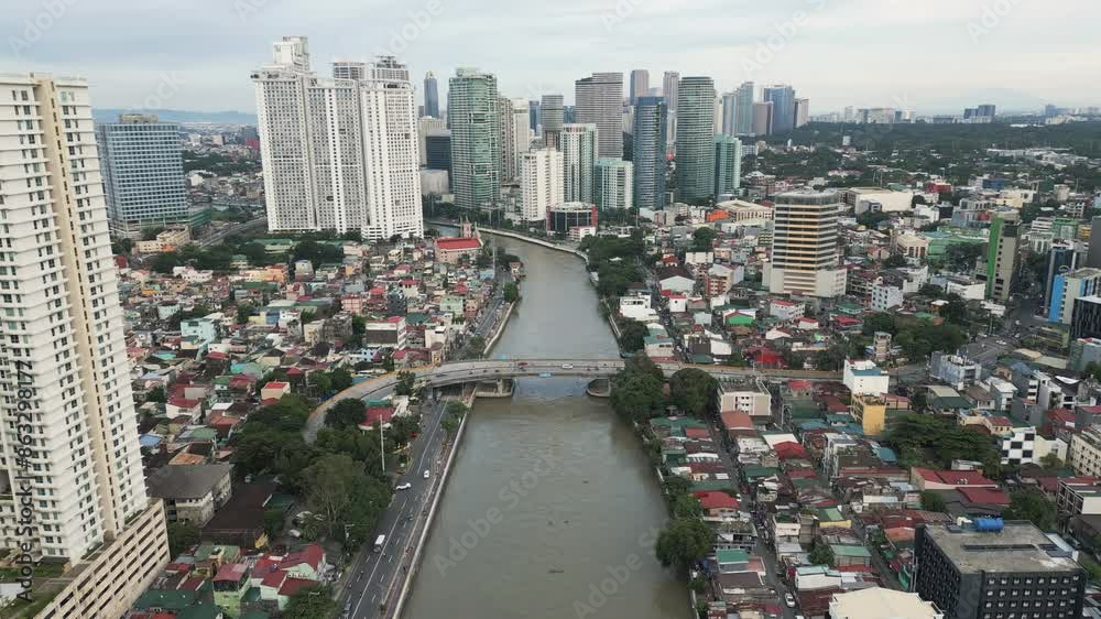 Flying forwards above the Metro Manila, the capital of Philippines. Aerial video, panoramic view.
