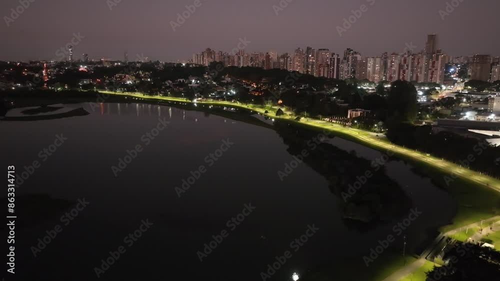 Curitiba in Paraná, Brazil. Aerial View. Wonderful sunset with views of buildings and Tanguá Park. Lake with reflection.
Curitiba in Paraná, Brazil. Aerial View. Wonderful sunset with views of buildings and Tanguá Park. Lake with reflection.