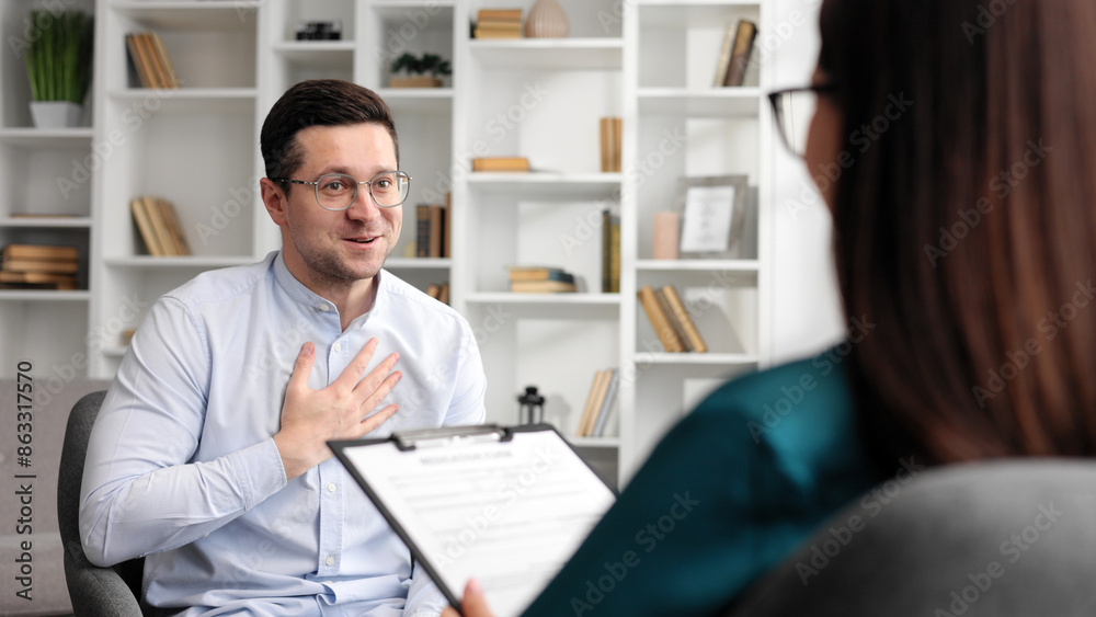 A happy male patient thanks his psychologist for his help. Finished positive result of psychological consultation, mental health. A happy male patient thanks his psychologist for his help. Finished positive result of psychological consultation, mental health.