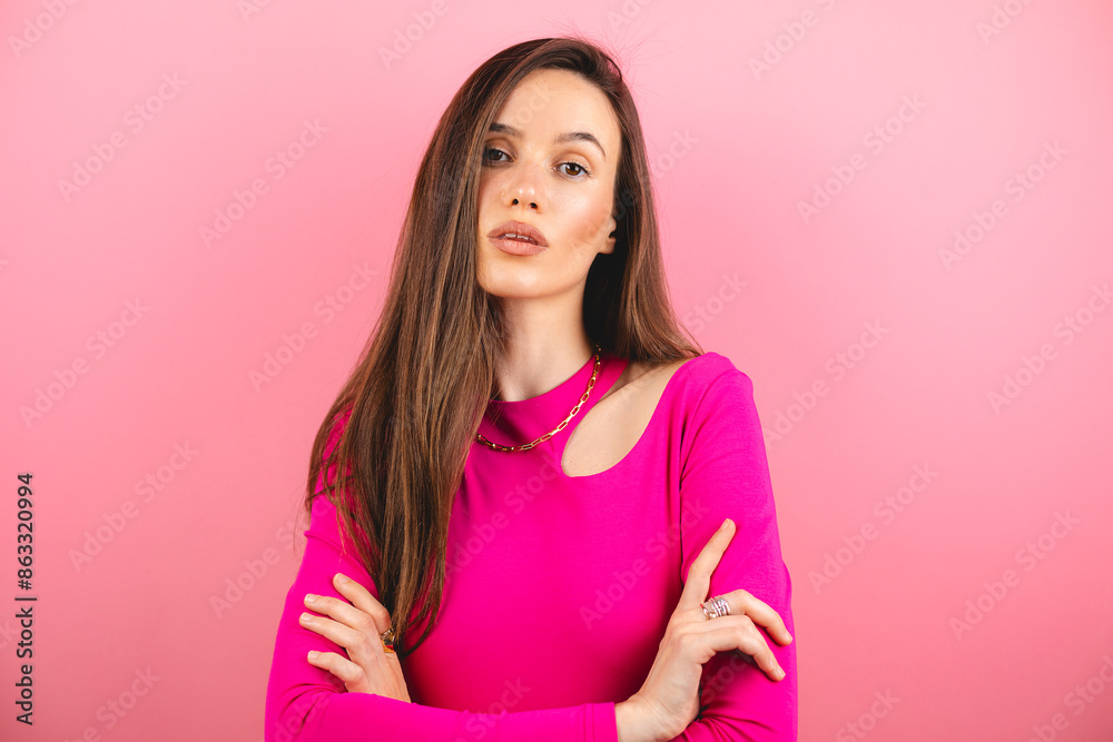 Caucasian woman with no expression, cross hands. ID or passport photo full collection of diverse face and expressions. Calm interesting woman in pink long sleeves with serious face on pink background Caucasian woman with no expression, cross hands. ID or passport photo full collection of diverse face and expressions. Calm interesting woman in pink long sleeves with serious face on pink background