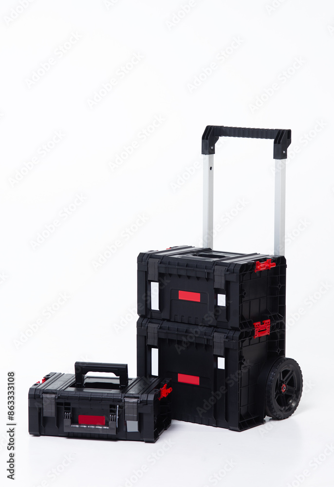 Big black toolbox for carried construction tools on wheels, on white background, isolated Big black toolbox for carried construction tools on wheels, on white background, isolated