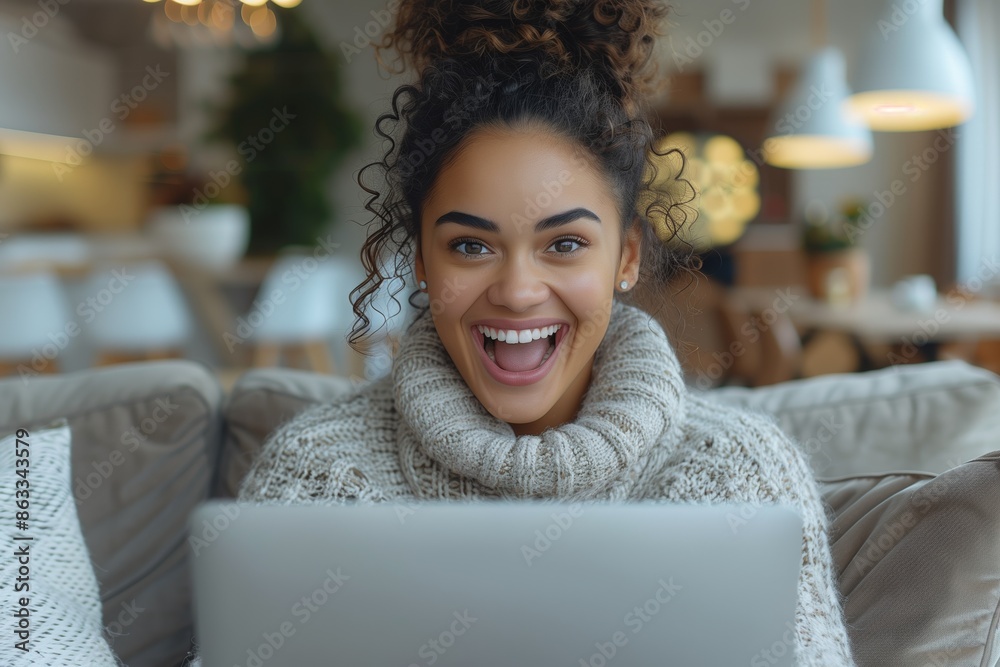Excited African American Woman at Home with Laptop and Good News Excited African American Woman at Home with Laptop and Good News