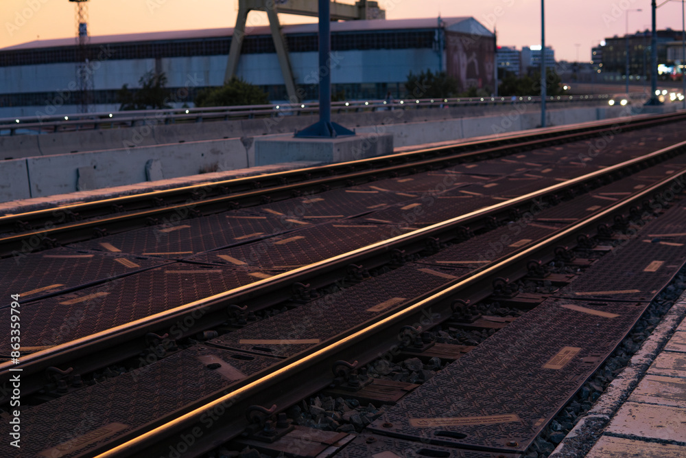 Fototapeta premium close-up of railway tracks in the setting sun. High quality photo