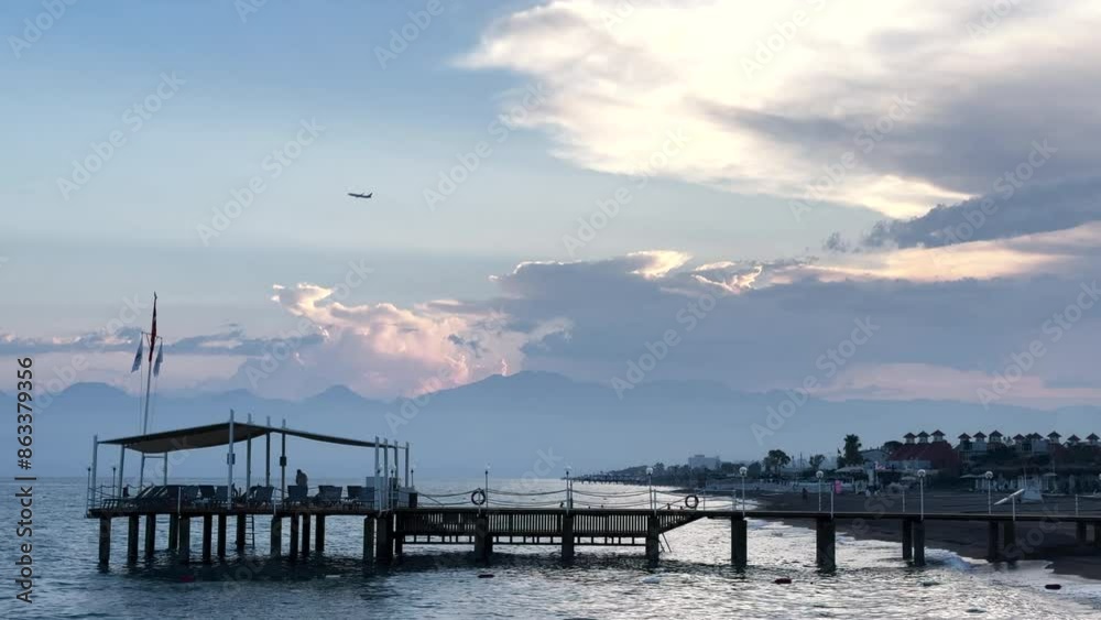 Turkey, Antalya. Sunset on the beach, beautiful sky and calm sea Turkey, Antalya. Sunset on the beach, beautiful sky and calm sea