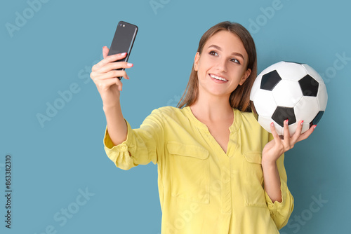 Young woman with soccer bal...