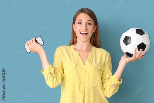 Young woman with soccer bal...