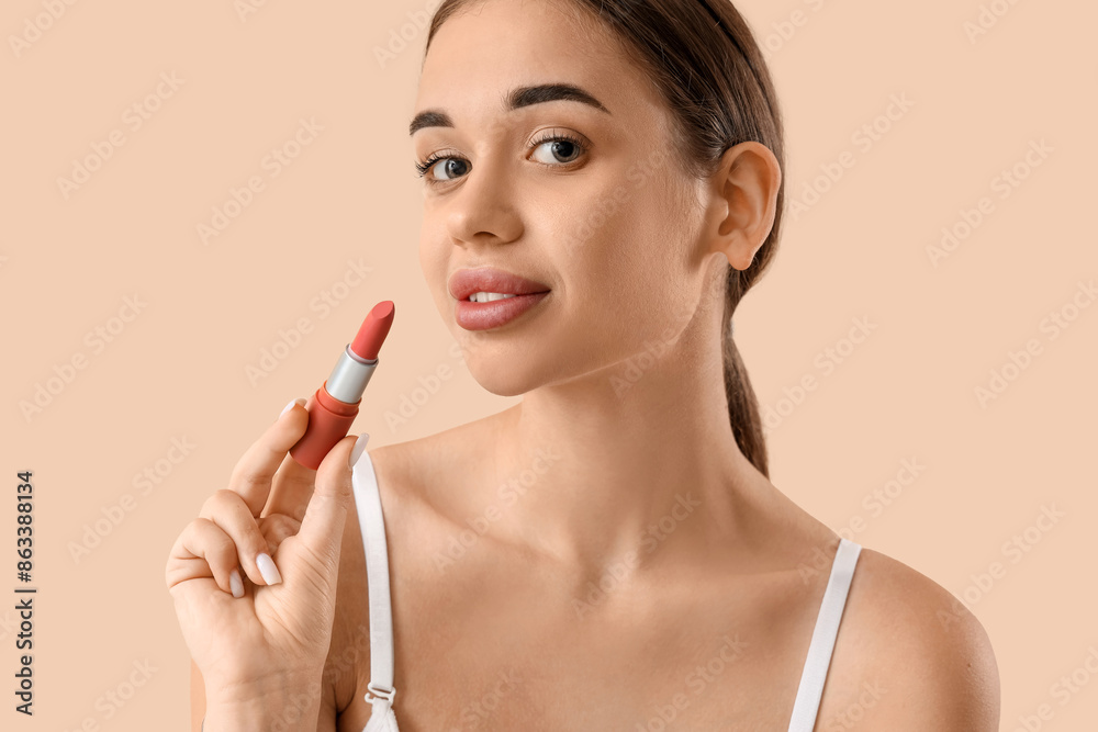 Young woman with lipstick on light background Young woman with lipstick on light background