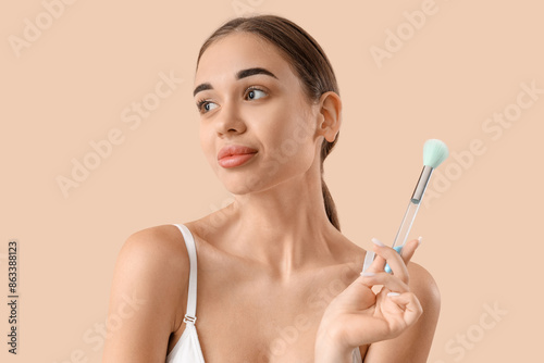 Young woman with makeup bru...