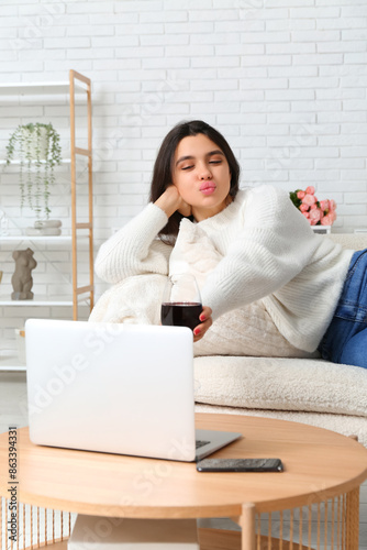 Young woman with glass of w...