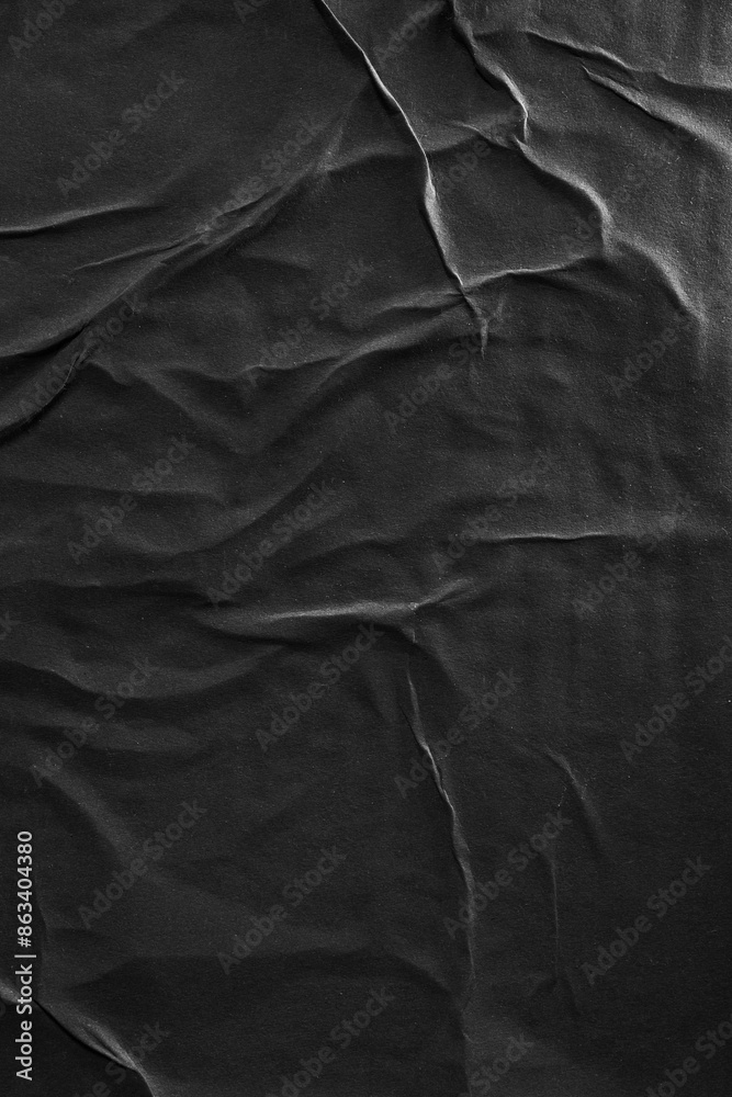 Vertical black crumpled paper poster texture background Vertical black crumpled paper poster texture background