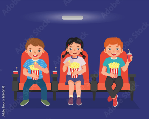 Cute little kids watching movies in cinema eating popcorn