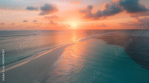 Fototapeta Naklejka Na Ścianę i Meble -  2. Aerial view of a Maldives beach at sunrise, where the soft hues of dawn reflect on the calm waters, creating a serene and tranquil atmosphere.