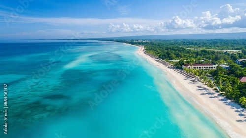 Fototapeta Naklejka Na Ścianę i Meble -  1. Aerial view of Seven Mile Beach, Jamaica, with its pristine white sands stretching along the turquoise Caribbean Sea, bordered by lush green palm trees and resorts under a clear blue sky.