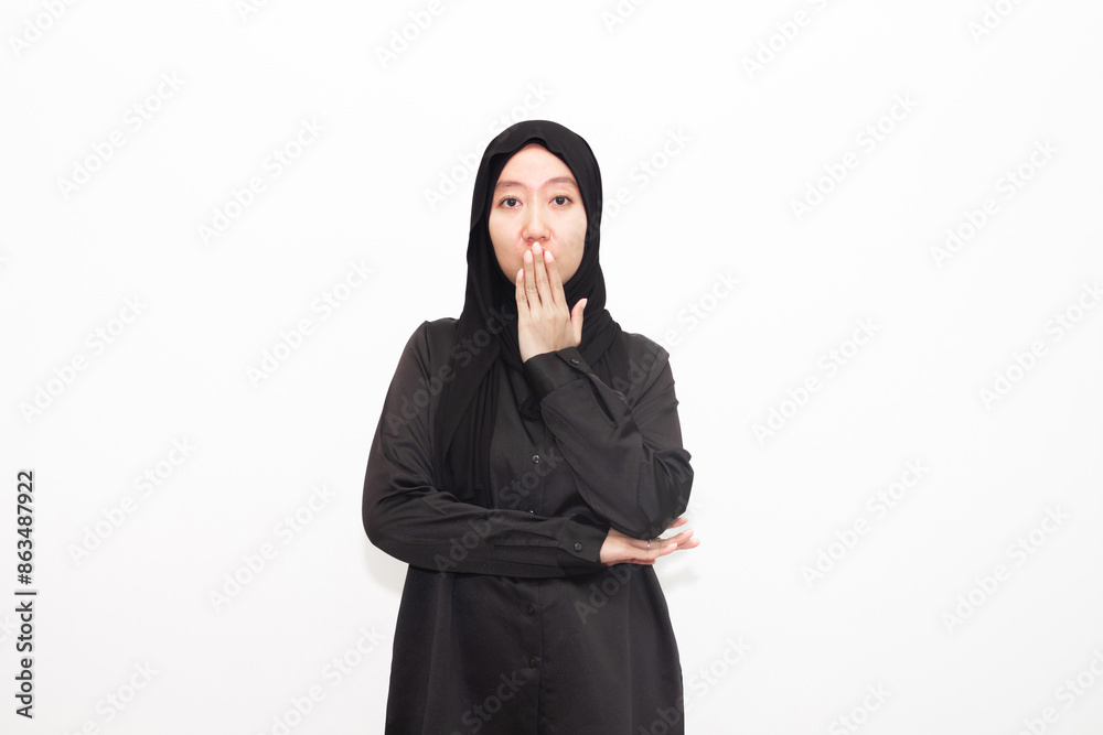 Young Asian Muslim woman in hijab with surprised expression. Isolated in white background. Young Asian Muslim woman in hijab with surprised expression. Isolated in white background.
