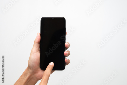 Wallpaper Mural Man's hand holding a smart phone screen view from above. isolated in white background Torontodigital.ca