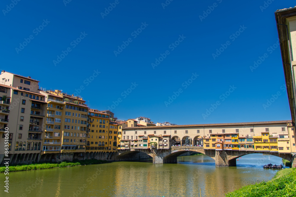 View of the famous Ponte Vecchio over the Arno river in the city of Florence in Italy. View of the famous Ponte Vecchio over the Arno river in the city of Florence in Italy.