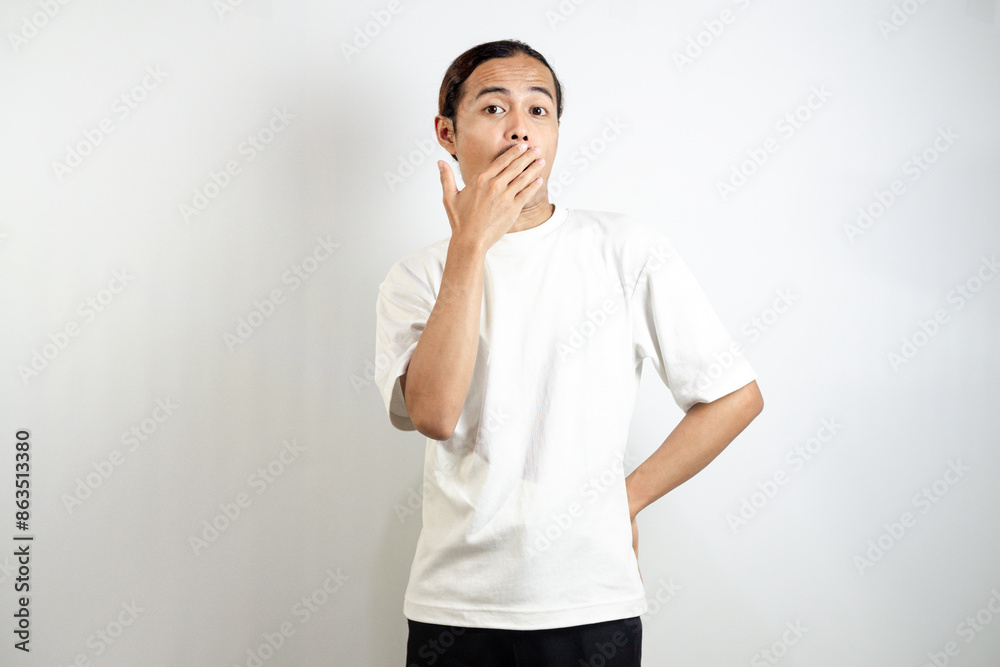 Young asian man with surprised facial expression. isolated on white. Young asian man with surprised facial expression. isolated on white.