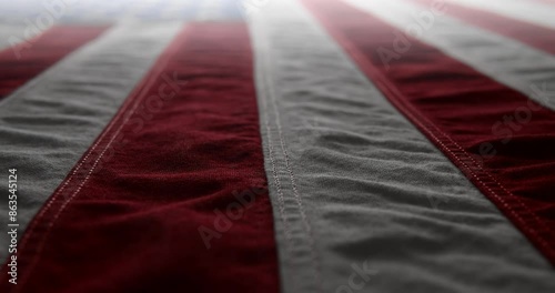 Panning across a brightly lit, red white and blue, US American flag. Background for Memorial Day, Veteran's Day, 4th of July, or other patriotic USA holiday. photo
