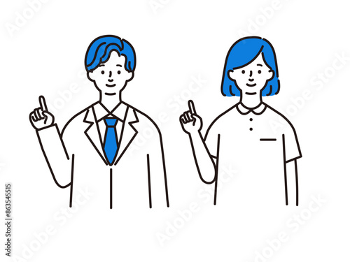 人差し指をたてる医療従事者の男女