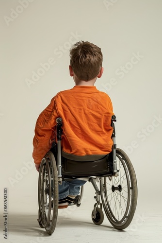 kid uses a wheelchair on solid background © Media Srock