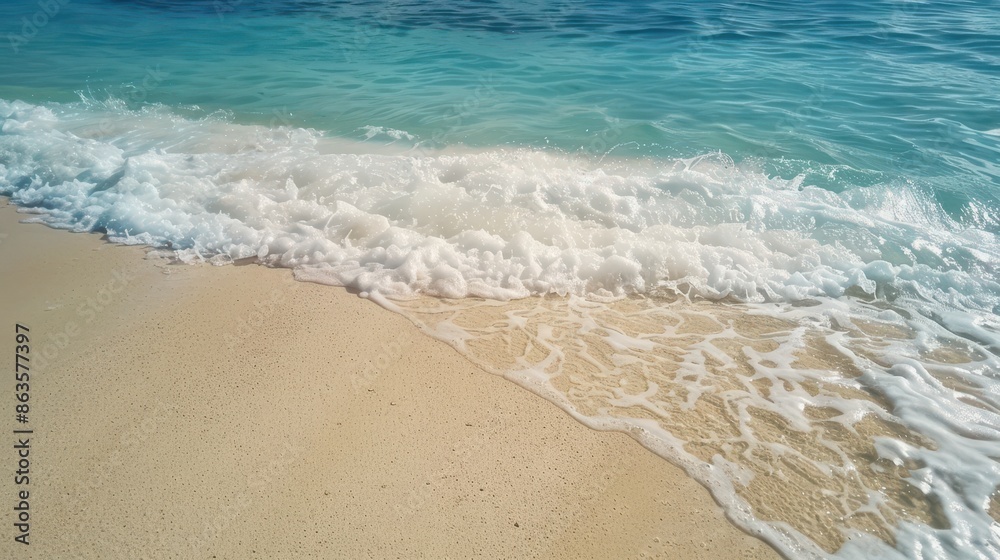 Gentle waves lapping on a sandy beach under a clear sky, creating a calm and peaceful scene. Gentle waves lapping on a sandy beach under a clear sky, creating a calm and peaceful scene.