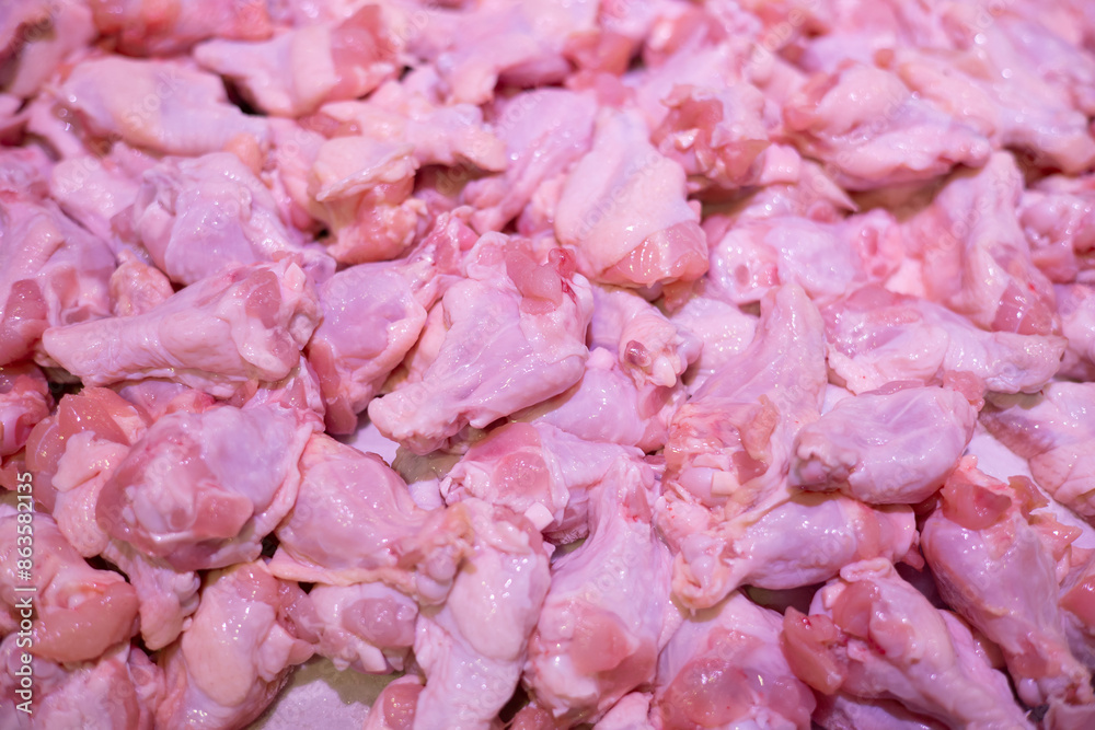 Many pieces of fresh chicken drumsticks for sale in supermarket, close-up photography Many pieces of fresh chicken drumsticks for sale in supermarket, close-up photography