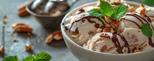 Vanilla Ice Cream With Chocolate Sauce, Pecans, and Mint Garnish