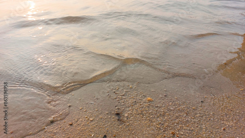 Fotografía Close up soft wave lapped the sandy beach